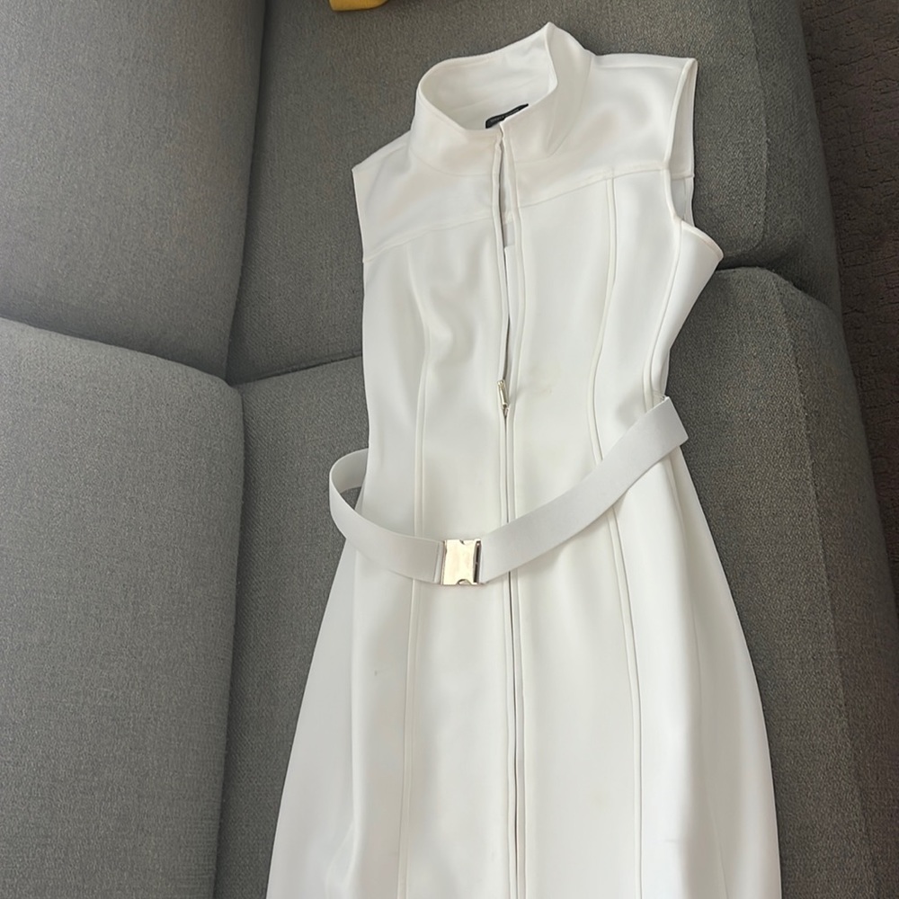 Tommy Hilfiger, white, size 14 but stretchable. Worn once, I’m size 6.